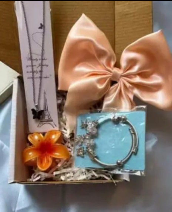 Gift hamper (jewellery set) 1 necklace, 1 flower shape,clutcher, bracelet, 1 hair bow
